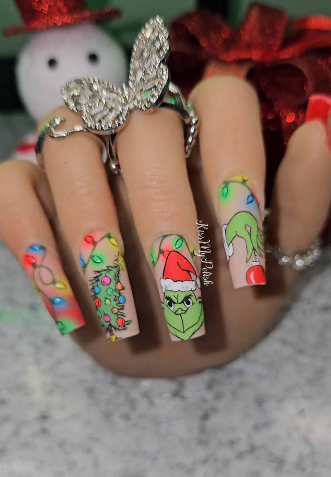 Get trendy with Grinchmas - press on nails available at Kiss My Polish.