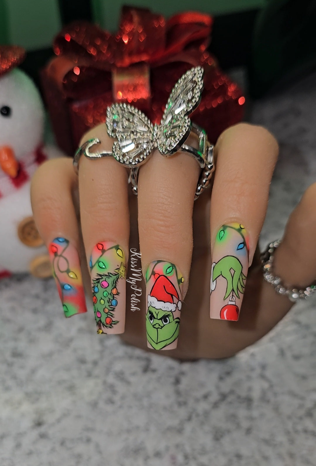 Get trendy with Grinchmas - press on nails available at Kiss My Polish.