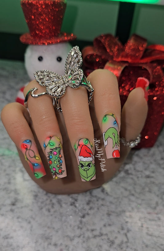 Get trendy with Grinchmas - press on nails available at Kiss My Polish.