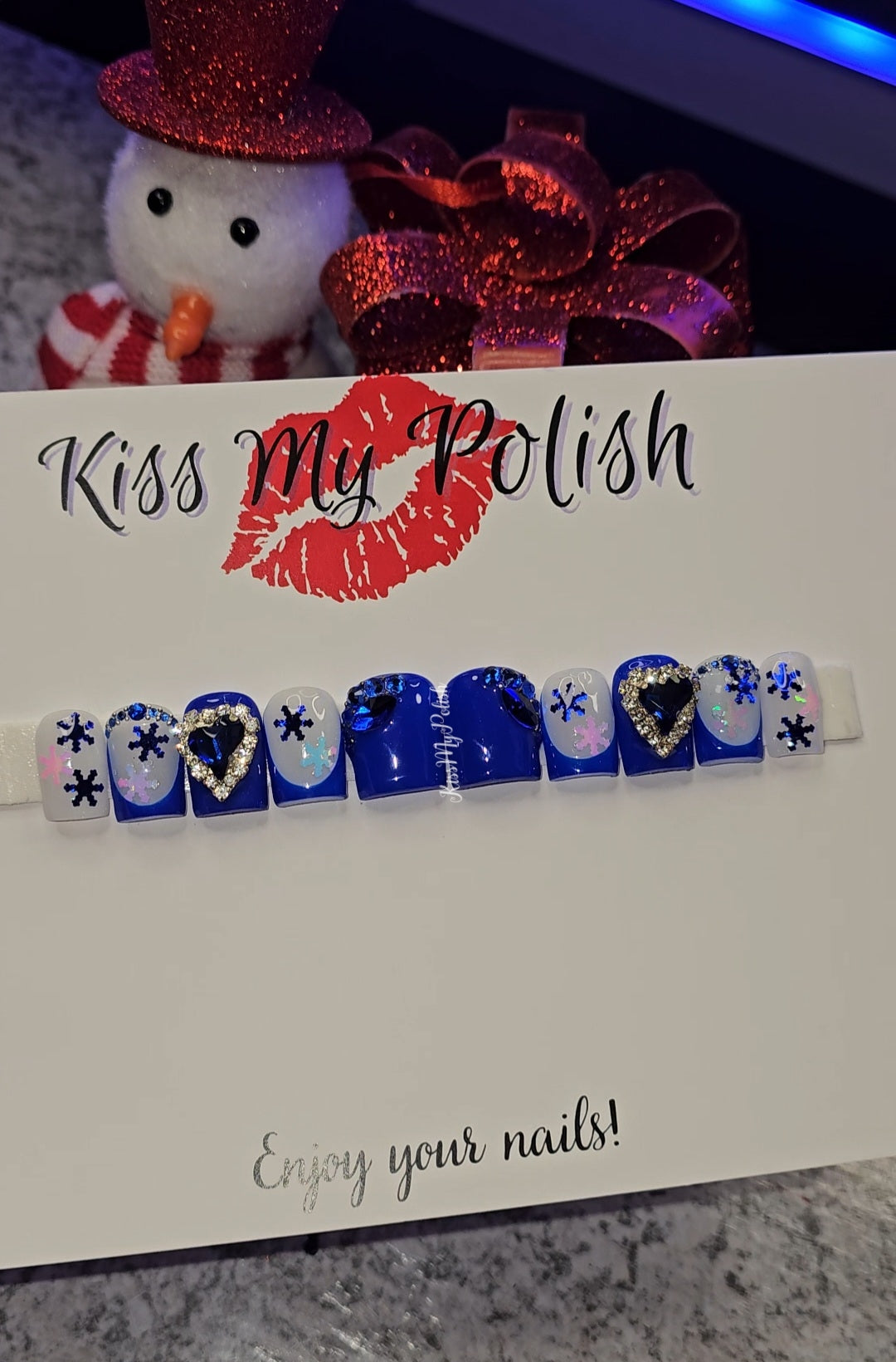 Get trendy with Blue Christmas Glam - press on nails available at Kiss My Polish.