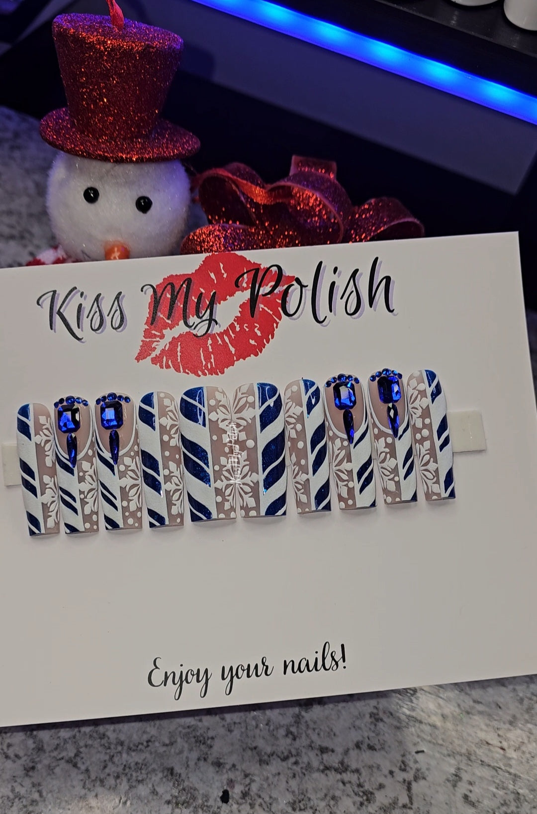 Get trendy with Blue Christmas - press on nails available at Kiss My Polish.