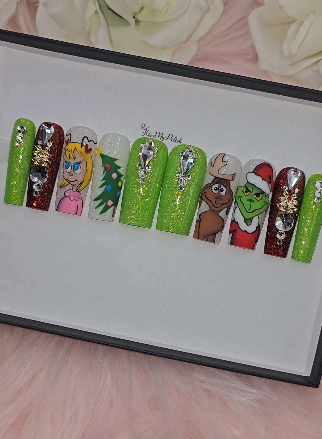 Get trendy with Grinch - press on nails available at Kiss My Polish.